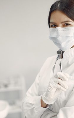 Beautiful dentist working on a dental clinic لورم ایپسوم متن ساختگی